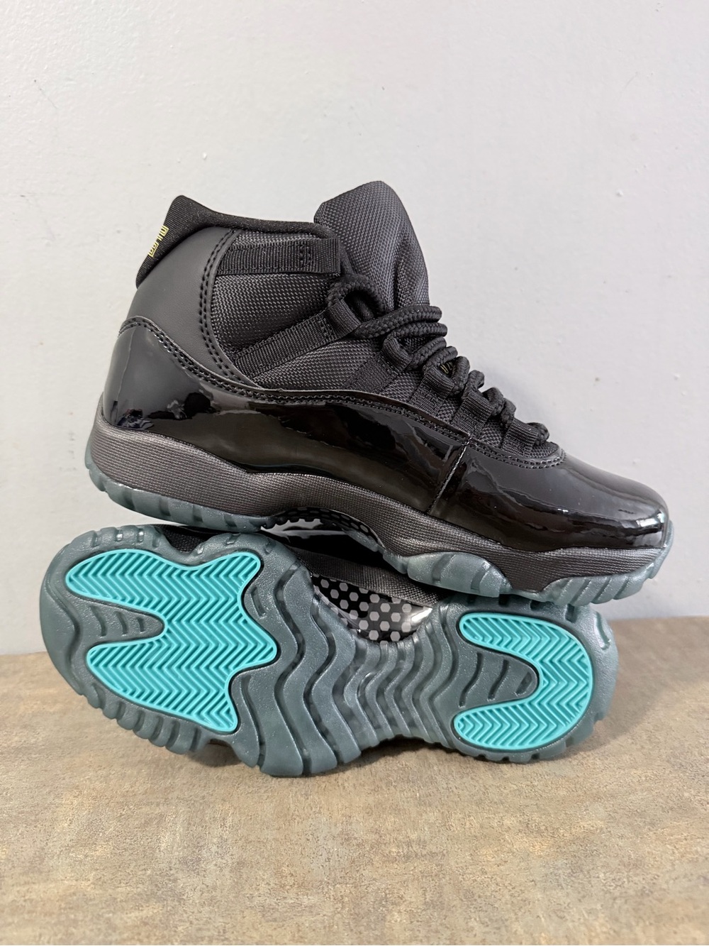 Jordan Women’s Sneakers in Black with Teal Soles